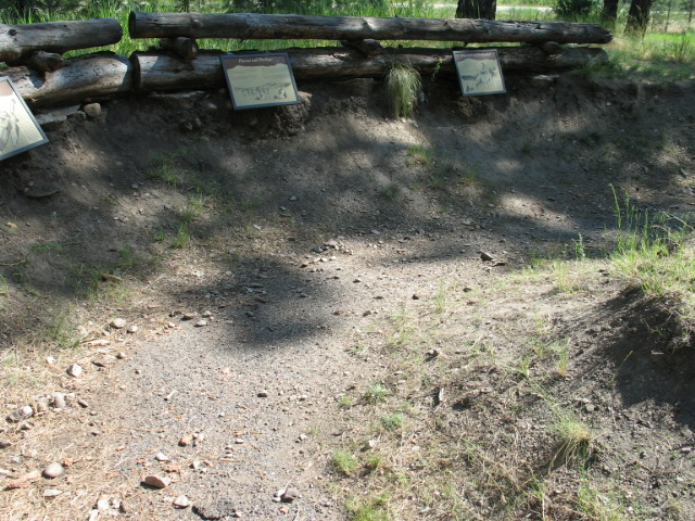 picture showing Fallen rock and dirt debris on the paved trail at the end of the entrenchment reenactment trail.